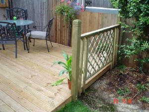 small deck with built in removable access to a drain cover